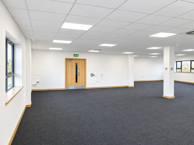Refurbished office with new carpet, redecorated walls and lobby doors
