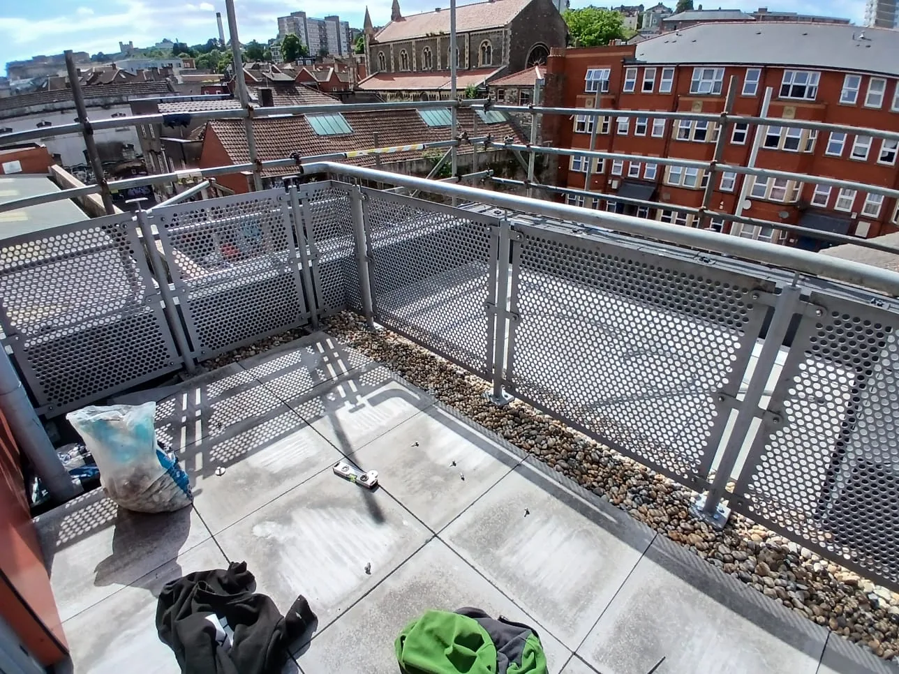 Balcony corner with refurbished balustrade panels and new paving