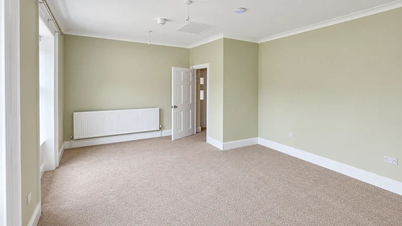 Redecorated room with new carpet, radiators and refurbished cornice